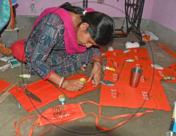 A local BJP leader in Burdwan Town is making a face mask with the symbol of Bharatiya Janata Party to prevent Novel Coronavirus (COVID-19)