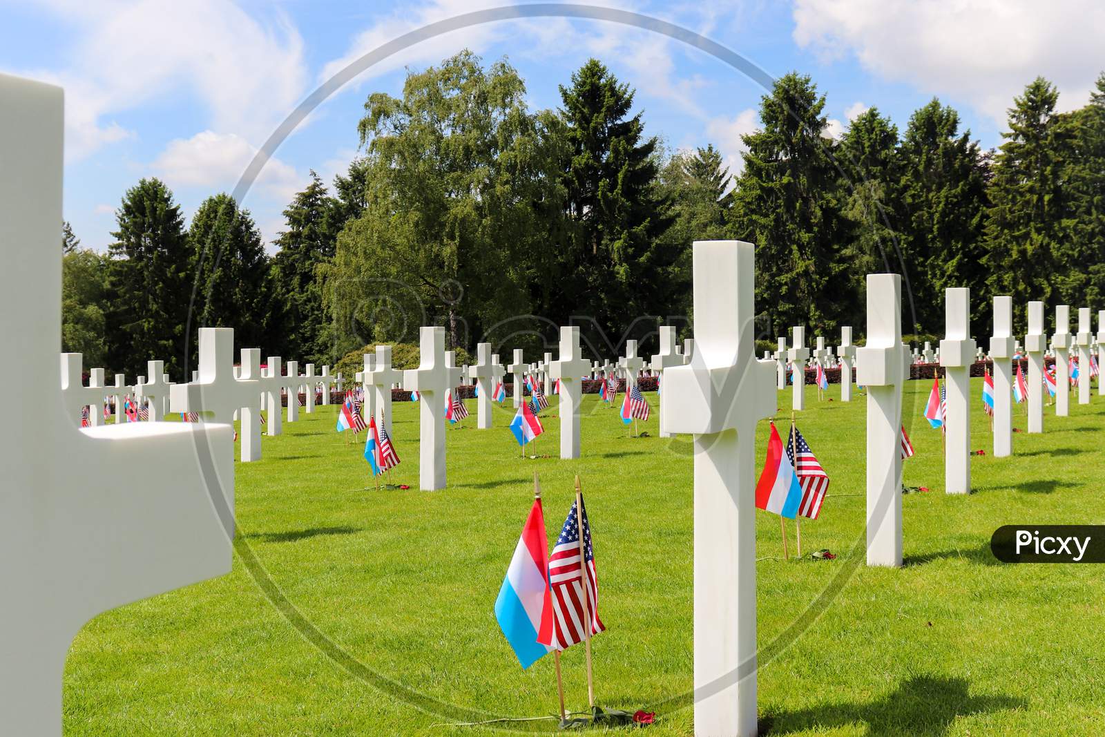 American And Luxembourg Flags On Graves For Memorial Day At The Luxembourg American Cemetery And Memorial.