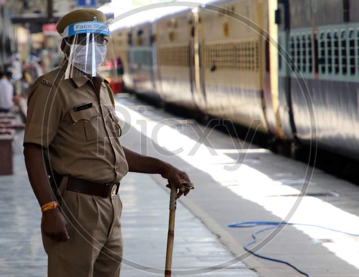 A Security Personnel Stands Near A Special Train Which Will Be On-Boarded By Migrants To Bihar State From Ajmer Railway Station During A Government-Imposed Nationwide Lockdown As A Preventive Measure Against The Covid-19 Or Coronavirus, In Ajmer on May 13, 2020.
