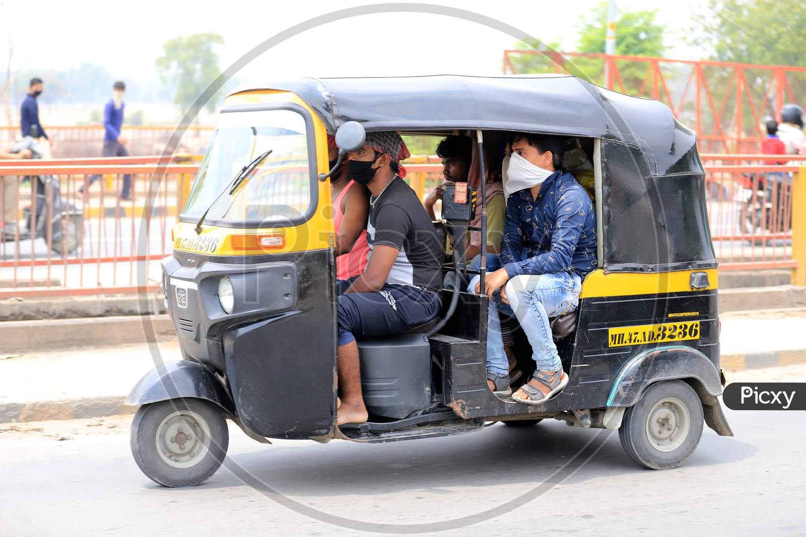 Migrant Workers Travel In An Autorickshaw To Reach Their Native Places During Nationwide Lockdown Amidst Coronavirus Or Covid-19 Pandemic In Prayagraj, 