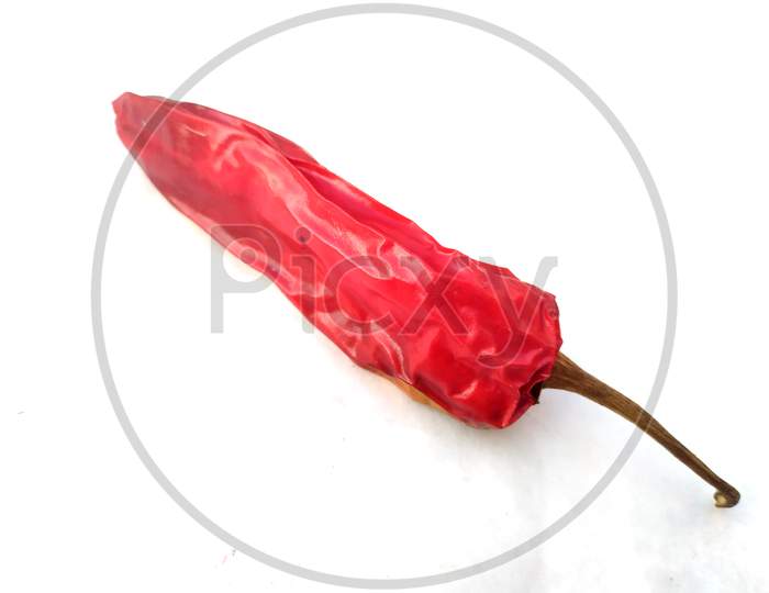 Dried red chili or chilli cayenne pepper isolated on white background cutout