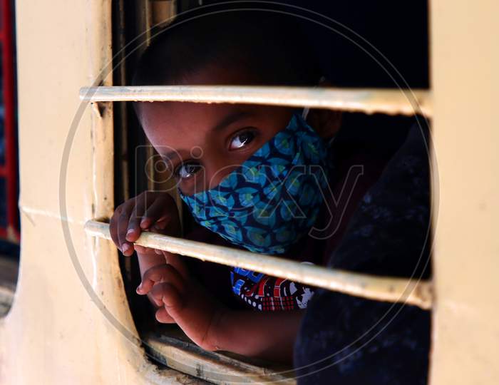  A Stranded migrant boards a special train to Bihar State from Ajmer railway station during a government-imposed nationwide lockdown as a preventive measure against the COVID-19 coronavirus, in Ajmer on May 13, 2020.