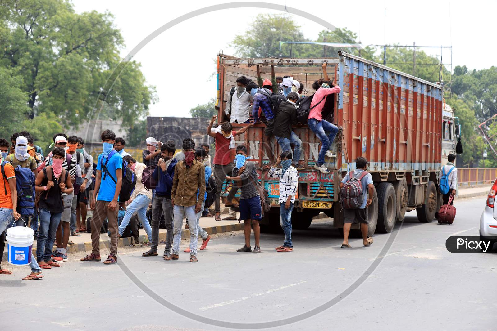 Migrant Workers Board A Truck To Reach Their Native Places During Nationwide Lockdown Amidst Coronavirus Or Covid-19 Pandemic In Prayagraj
