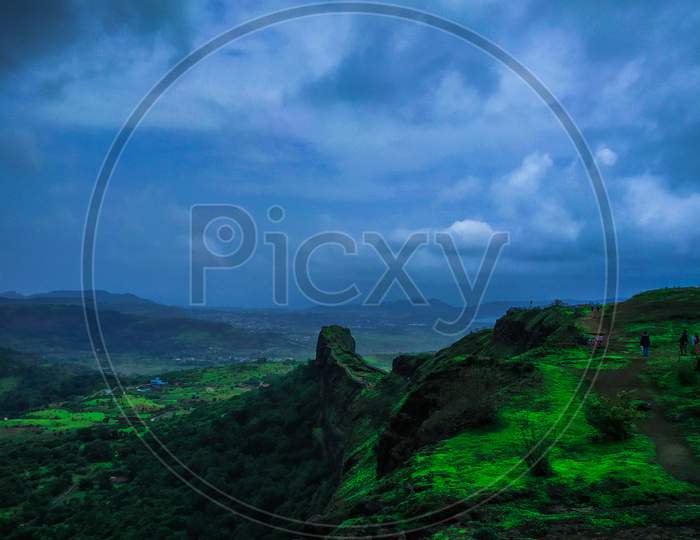 A Wide Angled View Of Lohagad, Pune, Maharashtra With Blue Sky And Clouds In Background And Different Colors