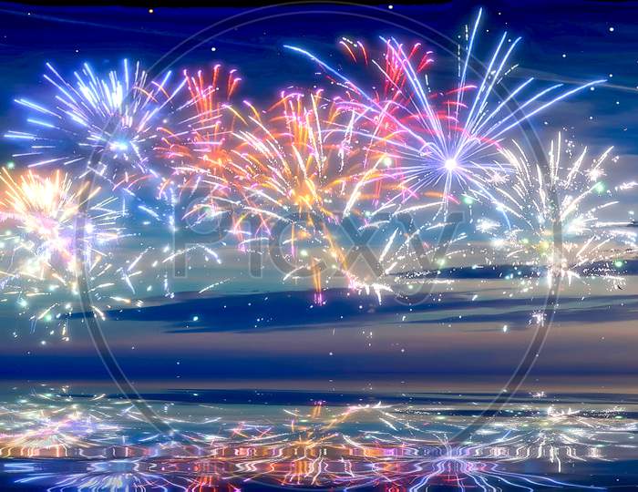 Beautiful and colorful fireworks in front of a blue evening sky