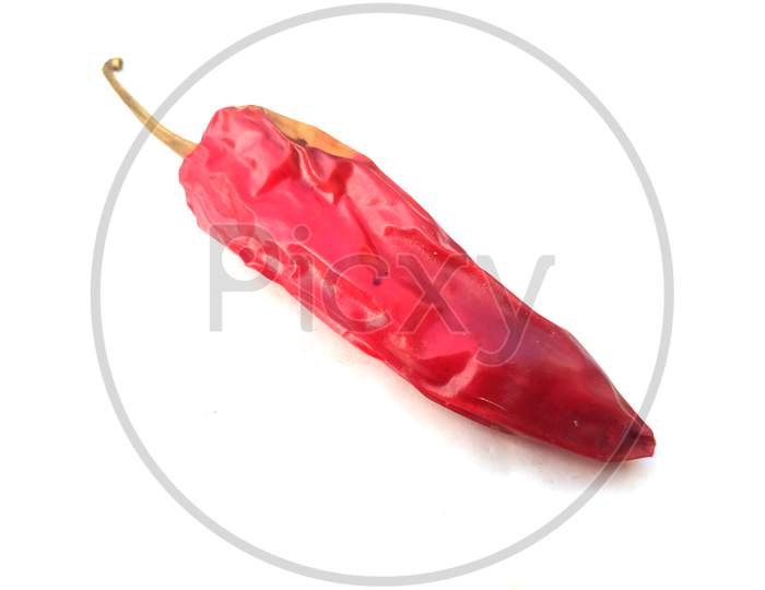 Dried red chili or chilli cayenne pepper isolated on white background cutout