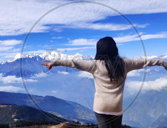Breathtaking View from Gosaikunda, langtang, Nepal,young woman in the mountains,