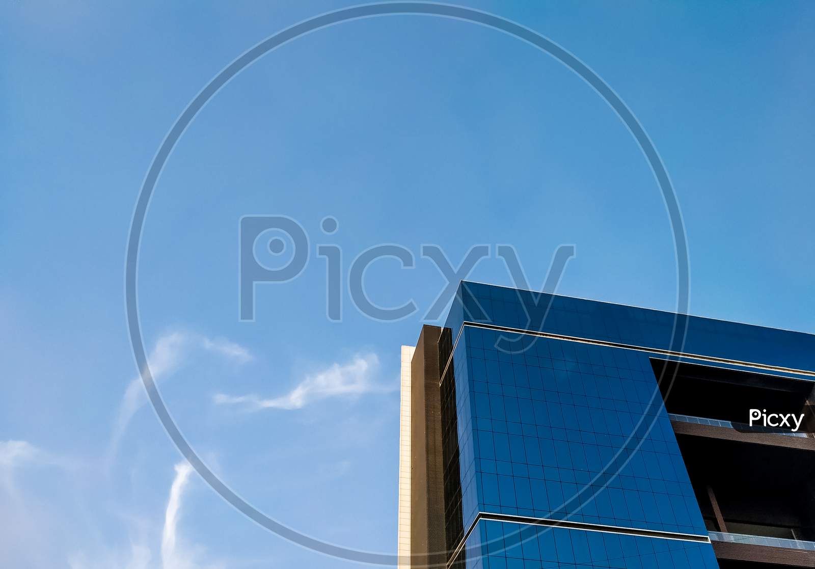 A Modern Architectural Glazing Building And Blue Sky