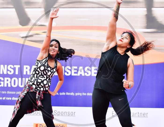 Zumba Dancers Performs Zumba During Marathon Warmup Session,Corporate yoga pose