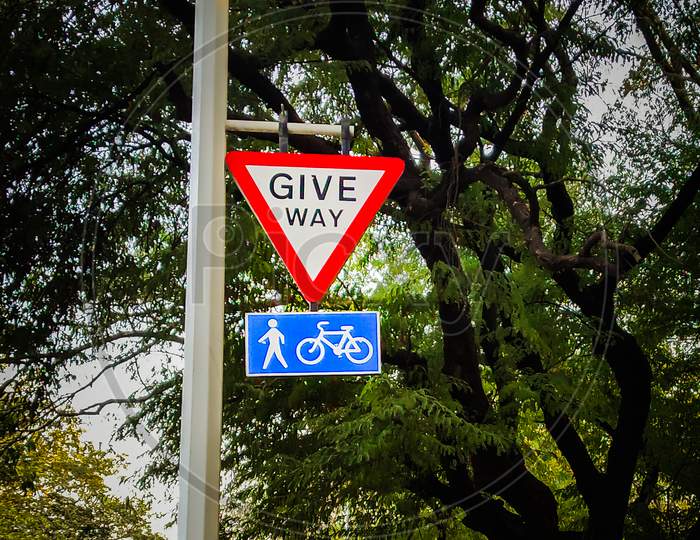 Give Way For Pedestrians And Cycle Sign Board In Urban City Of India