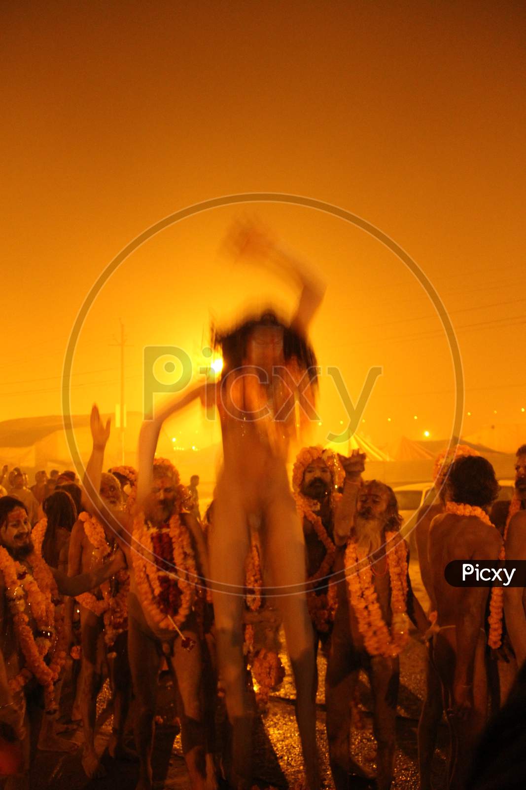 A Naga sadhu or a Hindu holy man stands during the "Shahi Snan" (grand bath) at "Kumbh Mela" in Allahabad, Uttar Pradesh, India.