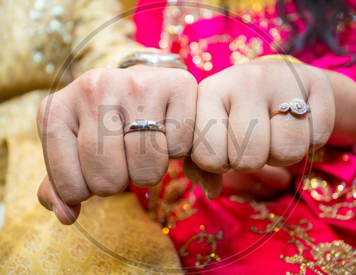 Married Couple Showing Their Wedding Rings At Bangladesh. Close Up Image.