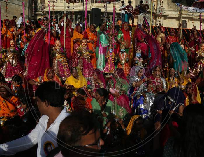 Indian married women take part in the Gangaur festival in Udaipur, in Rajasthan state, on April 8, 2019. During the Gangaur festival, married women worship the Hindu goddess Gauri, consort of the deity Shiva.