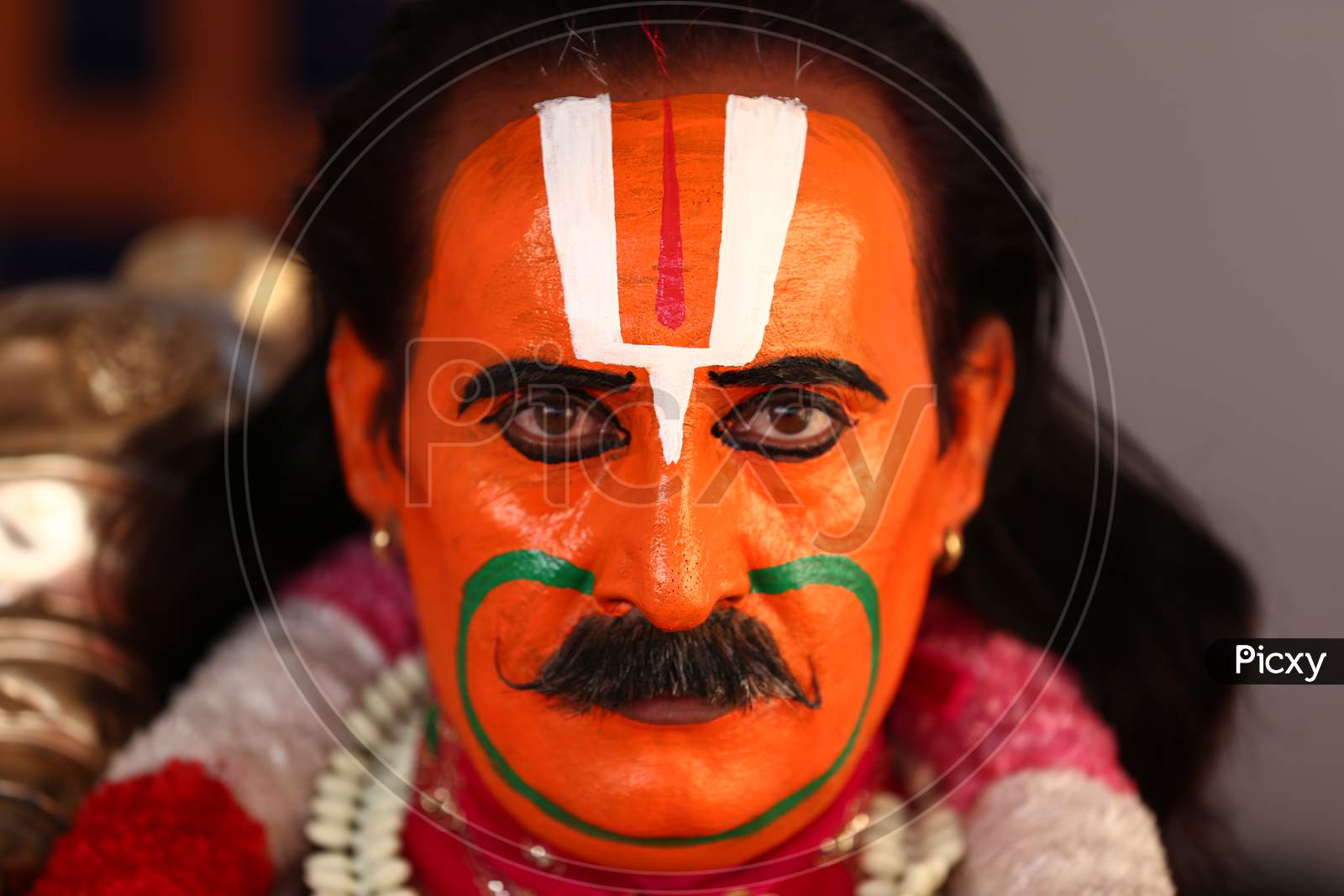 A Man dressed as Lord Hanuman during 'Dussehra' festival celebration in Pushkar, Rajasthan, India.