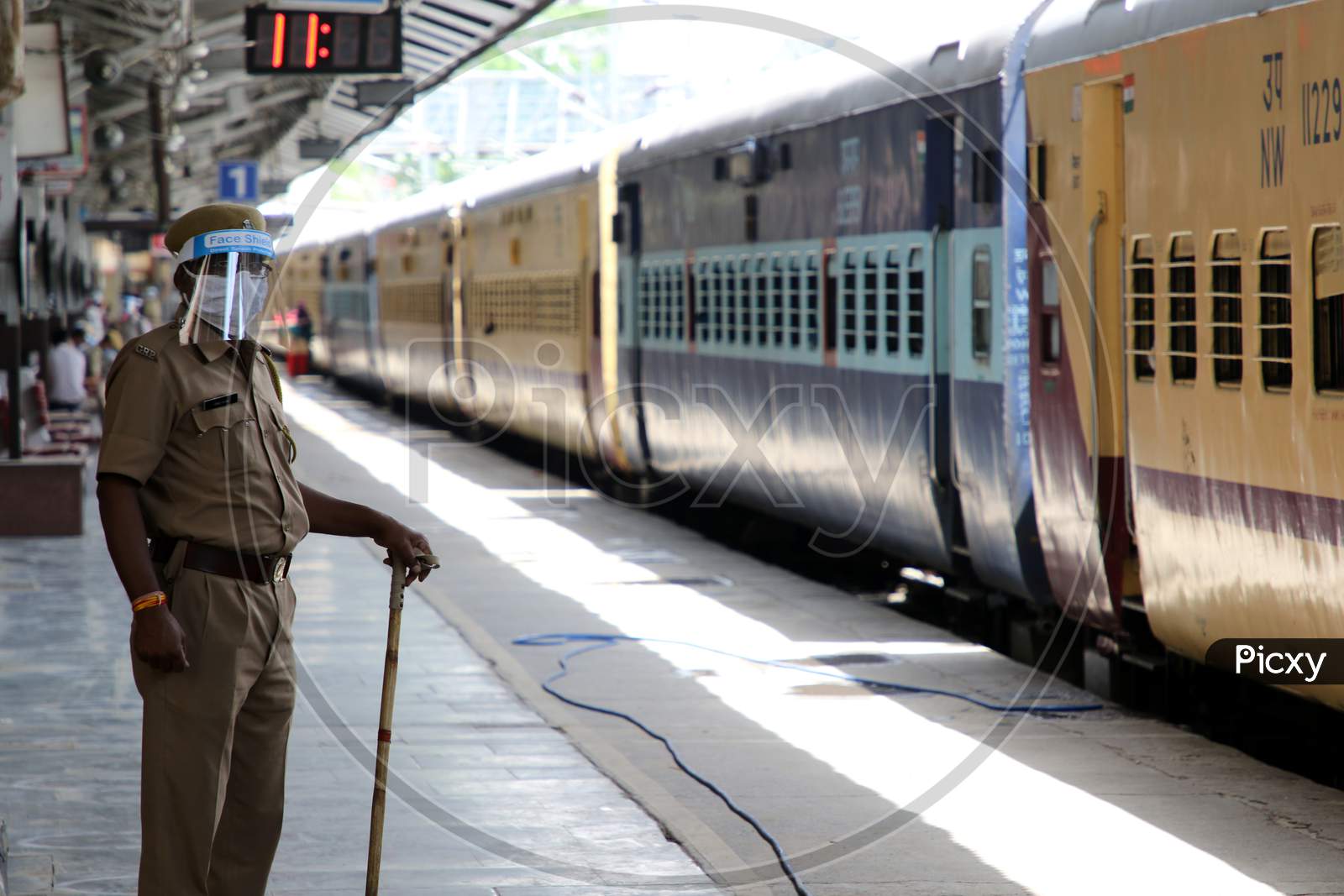  A Security Personnel Stands Near A Special Train Which Will Be On-Boarded By Migrants To Bihar State From Ajmer Railway Station During A Government-Imposed Nationwide Lockdown As A Preventive Measure Against The Covid-19 Or Coronavirus, In Ajmer on May 13, 2020.