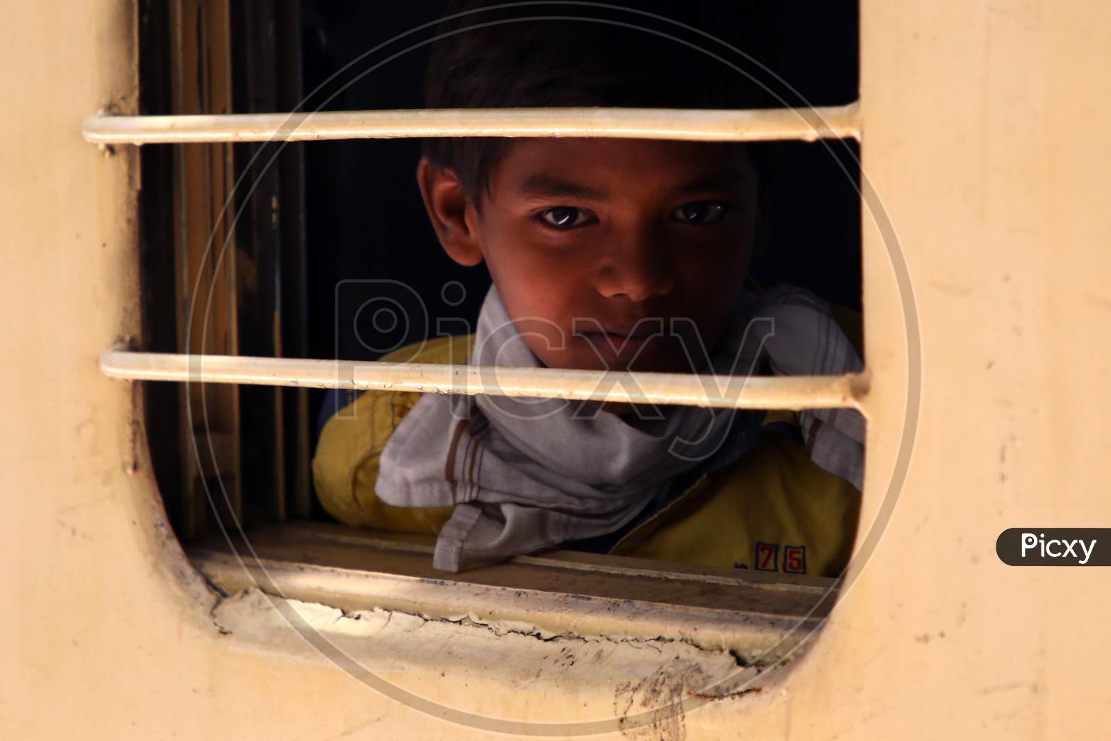 A Stranded migrant boards a special train to Bihar State from Ajmer railway station during a government-imposed nationwide lockdown as a preventive measure against the COVID-19 coronavirus, in Ajmer on May 13, 2020.