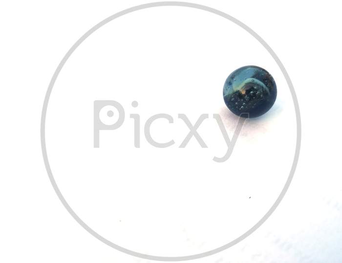 a black glass marble isolated on white background