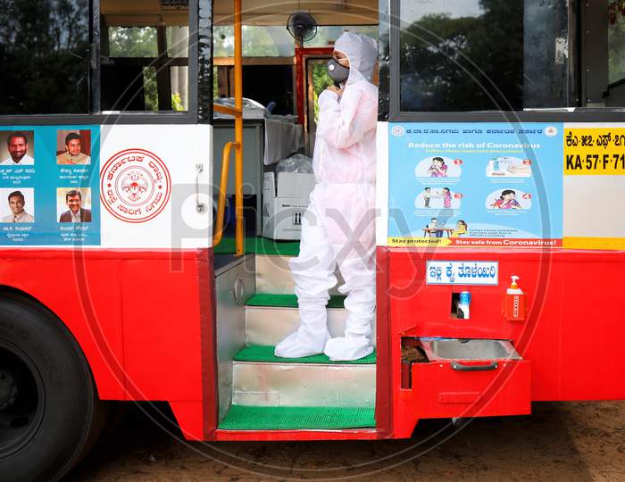 A doctor waits for personnel to test for covid-19 in a repurposed bus during a health screening camp for the police forces in Bangalore, India.
