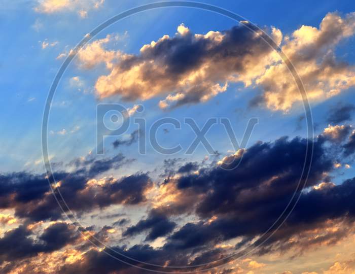 Beautiful red and orange cloud formations at sunrise in a panoramic sky view