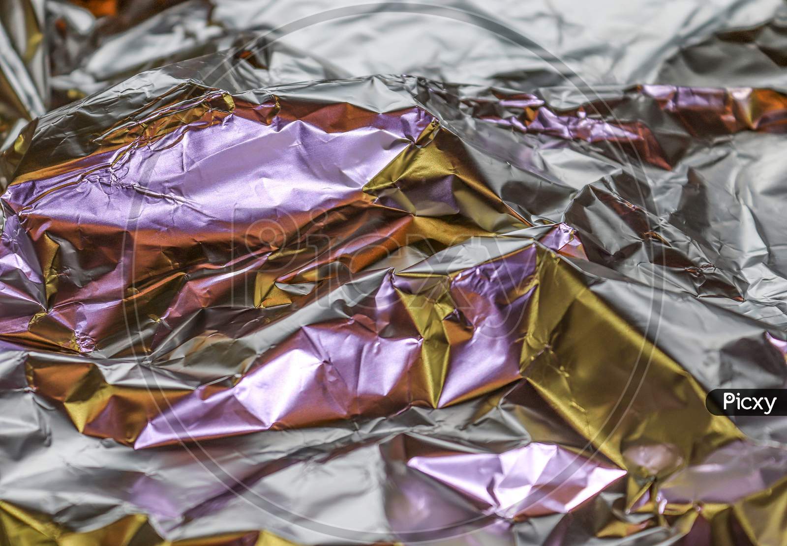 Detailed close up texture of an aluminum foil surface in different