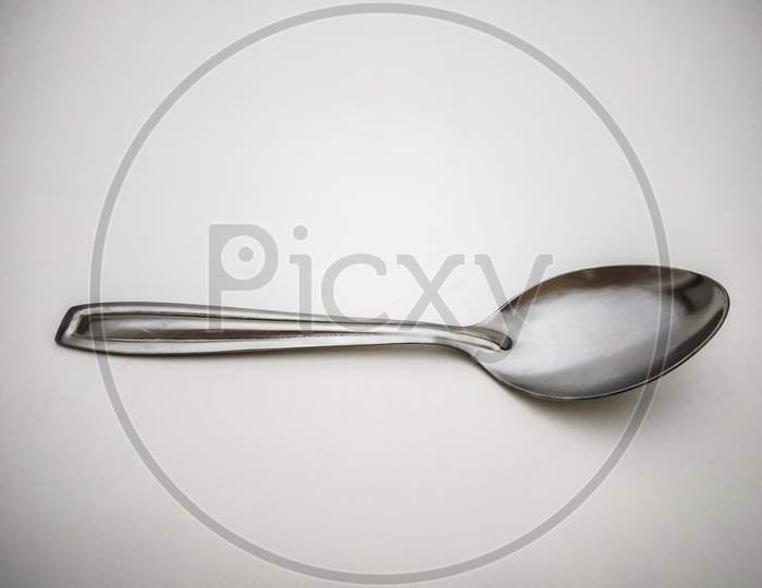 Stainless Steel Spoon Isolated With White Background