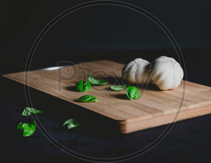 Natural Organic whole Garlic on wooden plate
