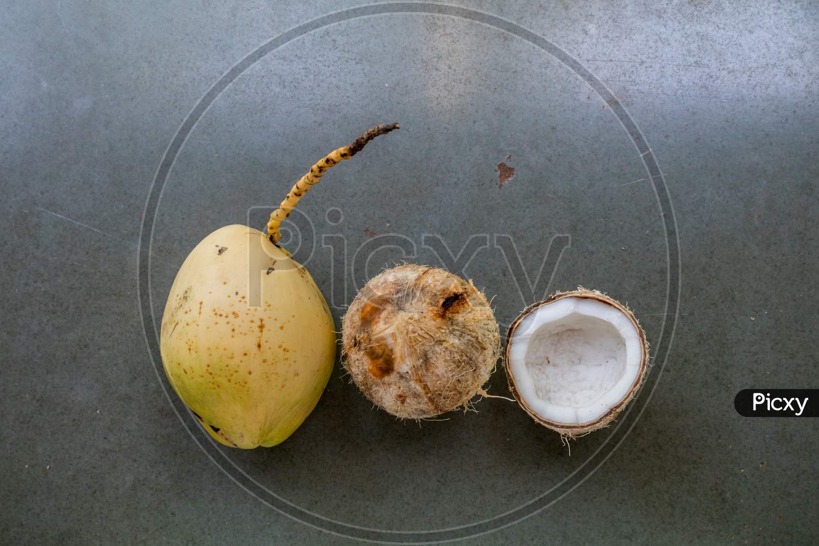 Coconut In Three Forms Tender, Pealed And Cracked