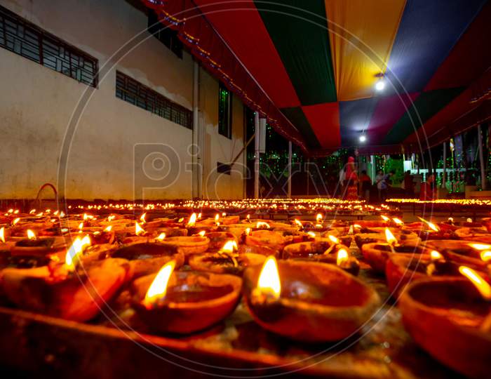 Bangladesh – October 13, 2019: Numerous Colorful Candles Are Flaming In The Buddhist Temple At Ujani Para Buddhist Temple In Bandarban, Bangladesh.