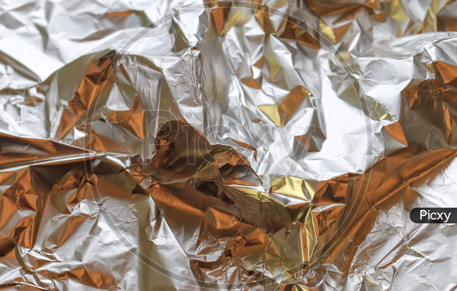 Detailed Close Up Texture Of An Aluminum Foil Surface In Different