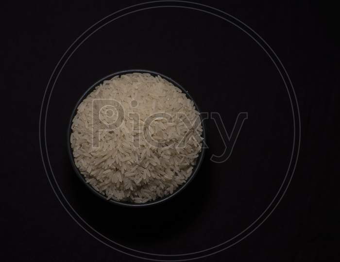 A Bowl Of Rice In Dark Copy Space Background. Food And Object Photography.