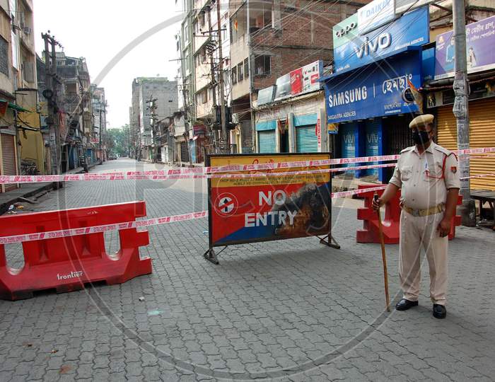 A Containment Zone Closed With Barricades and an Assam Policeman Guarding The Area Near Fancy Bazar During Coronavirus Or COVID-19 Pandemic in Guwahati