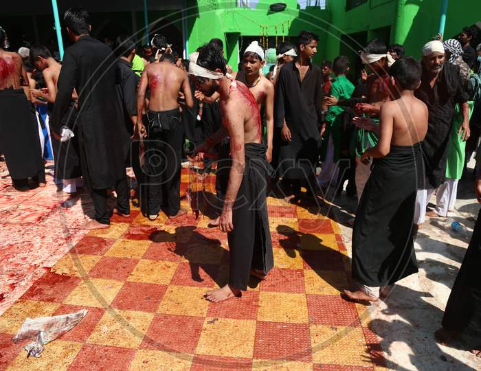 Shiite Muslim mourners flagellate themselves during a procession on the tenth day of Muharram which marks the day of Ashura in Ajmer, India.
