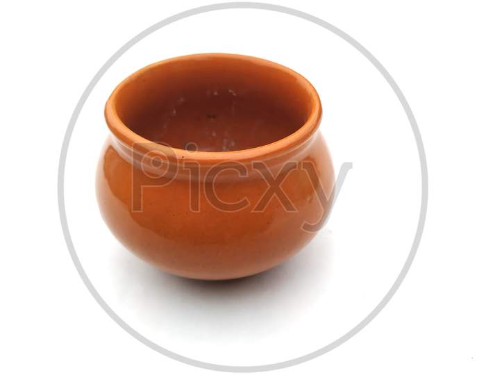 a brown color clay pot isolated on white background