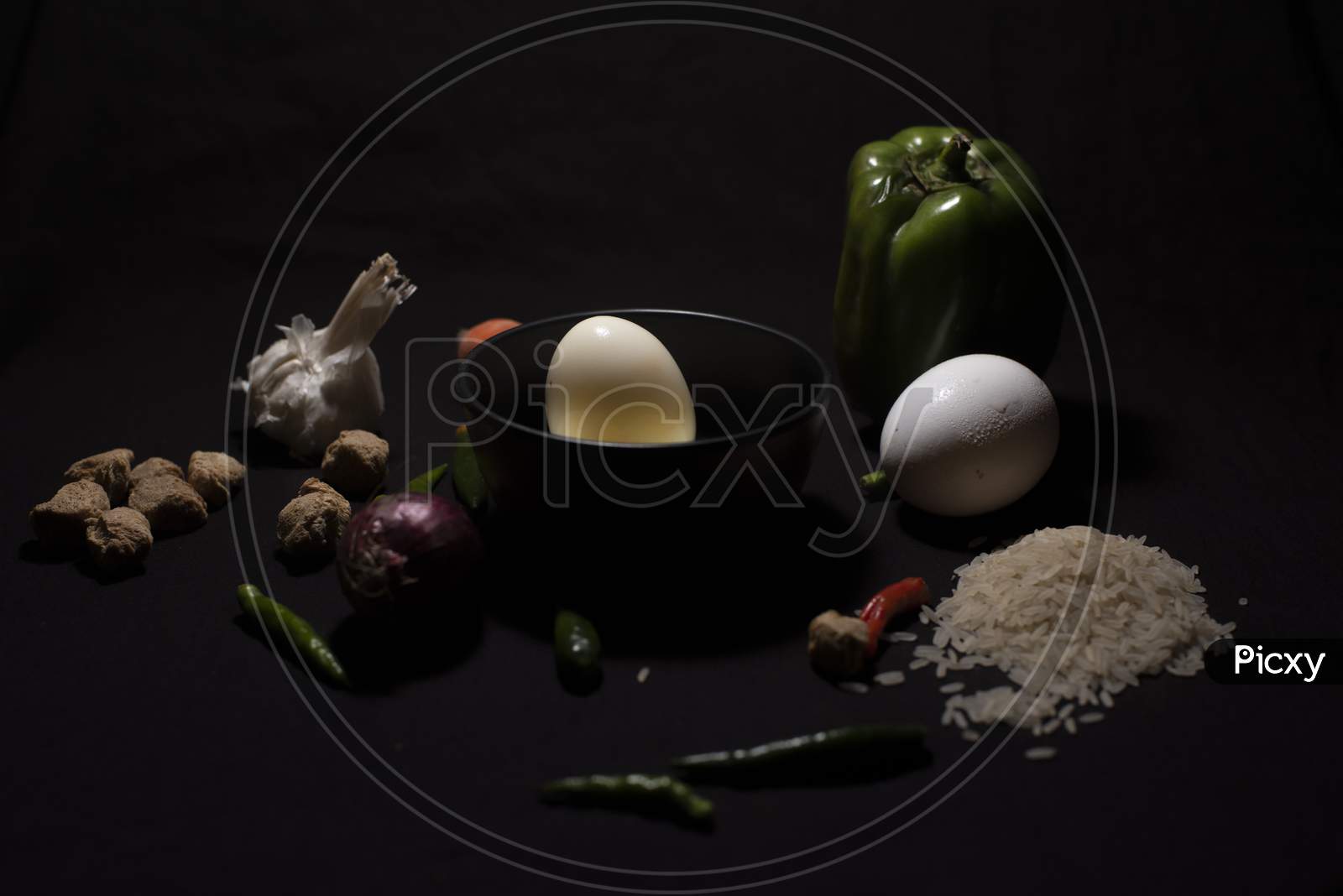 Boiled Eggs In A Bowl Decorated With Cereals And Vegetables In Dark Copy Space Background. Food And Product Photography.