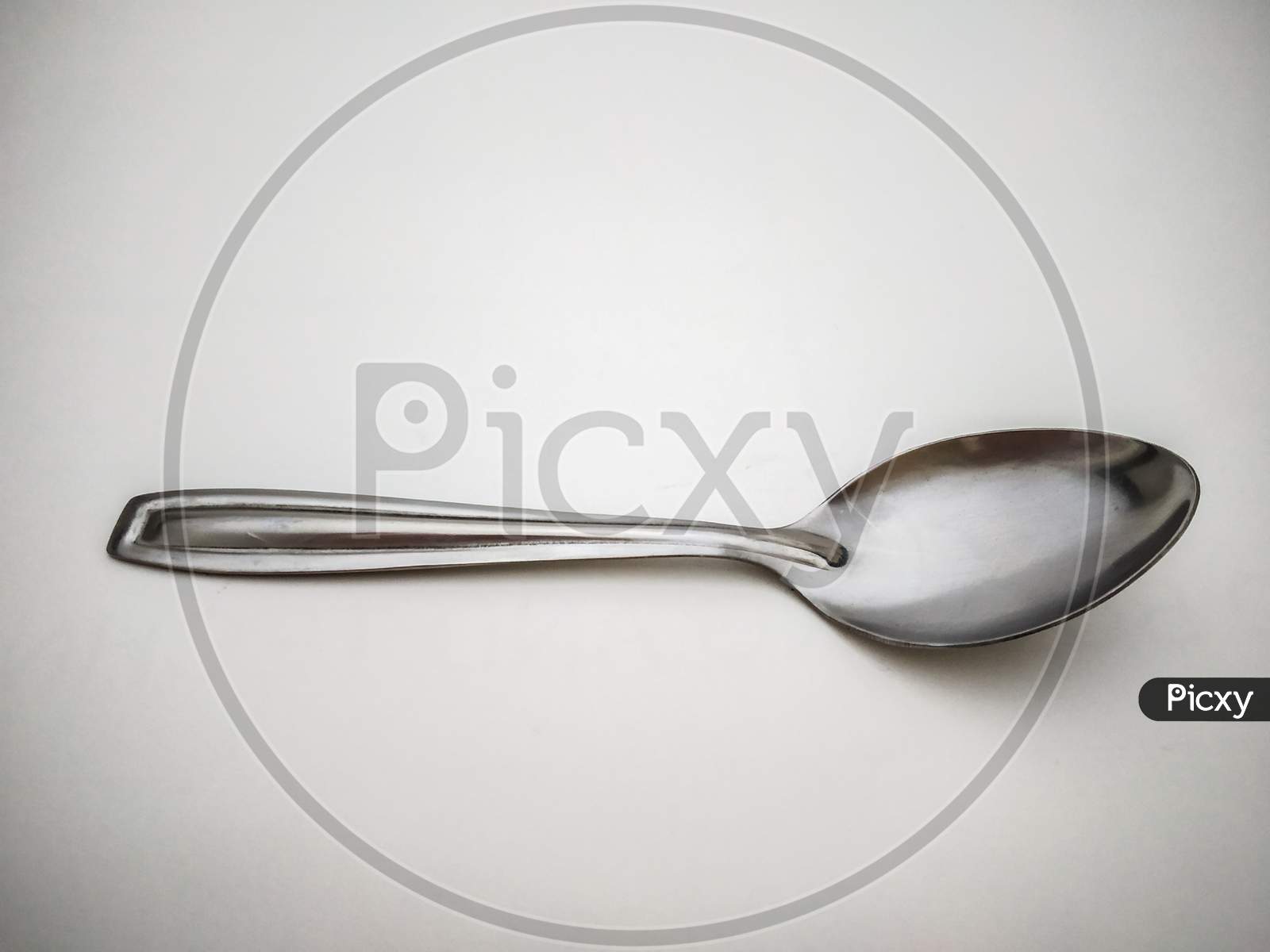 Stainless Steel Spoon Isolated With White Background