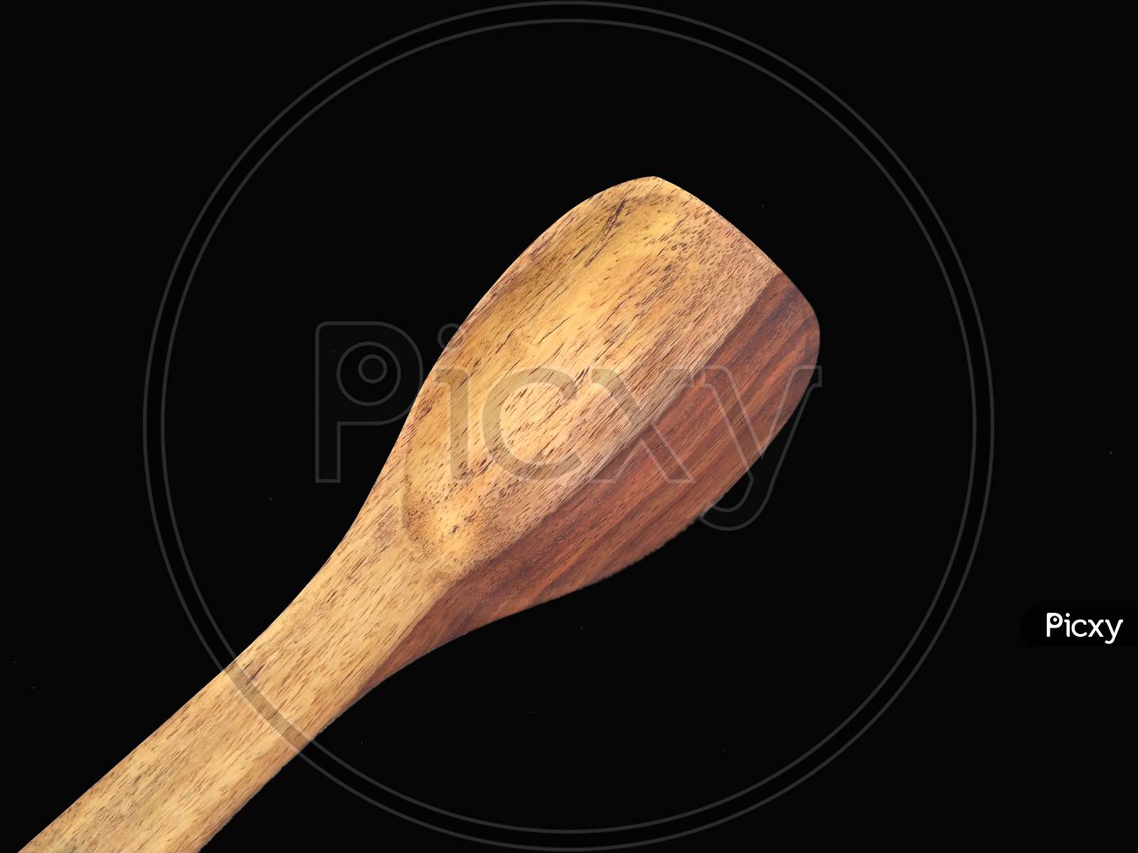 some wooden spatula isolated on black background