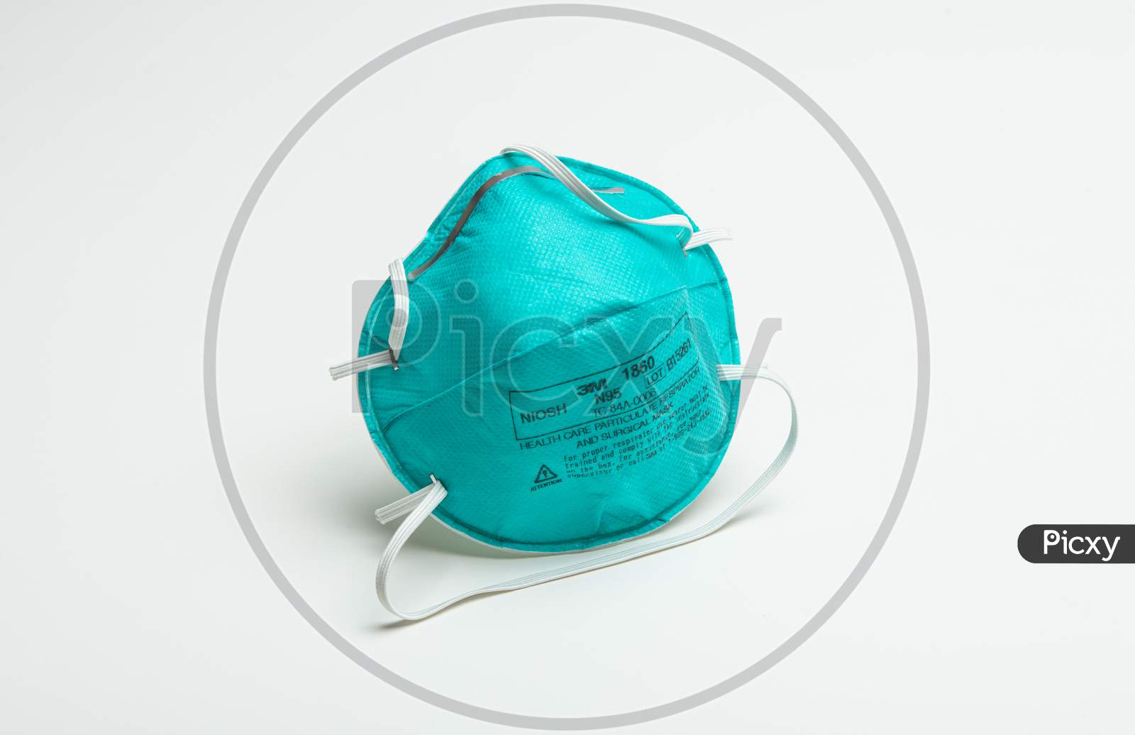 A Single Turquoise 3M N95 Respirator Face Mask