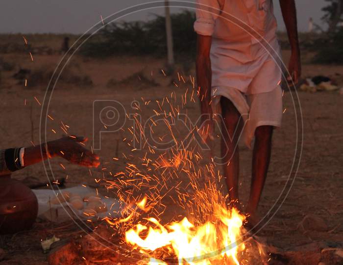 A Camel Trader Making Camp Fire In Nagaur Cattle Fair , Nagaur