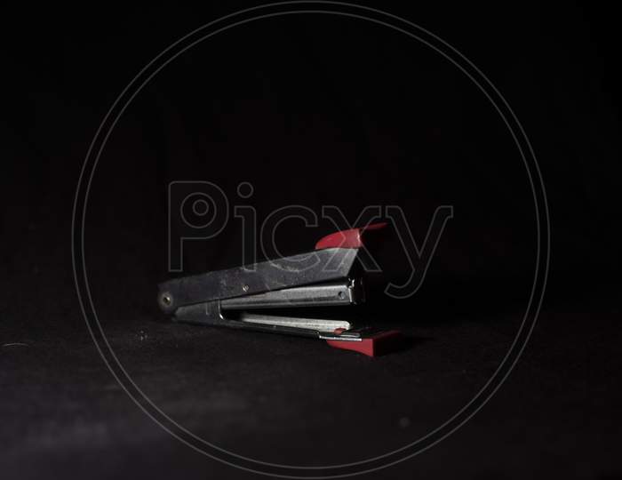 A Steel Stapler In A Dark Copy Space Background. Product Photography.