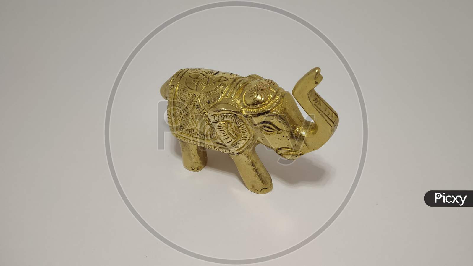 Statue of Golden metal elephant in white background
