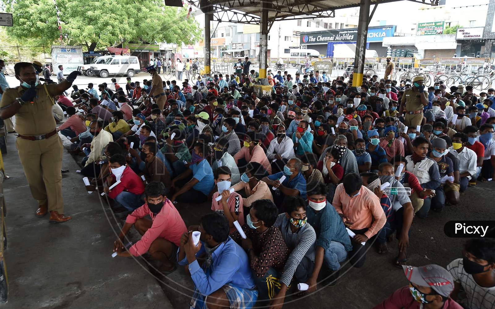 Migrant Labourers From Bihar Wait To Get Thermal Screening And Document Verification Before They Leave To Them Native Places During The Ongoing Nationwide Lockdown In The Wake Of Coronavirus Pandemic, In Chennai