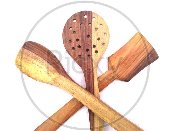 some wooden spatulas isolated on white background