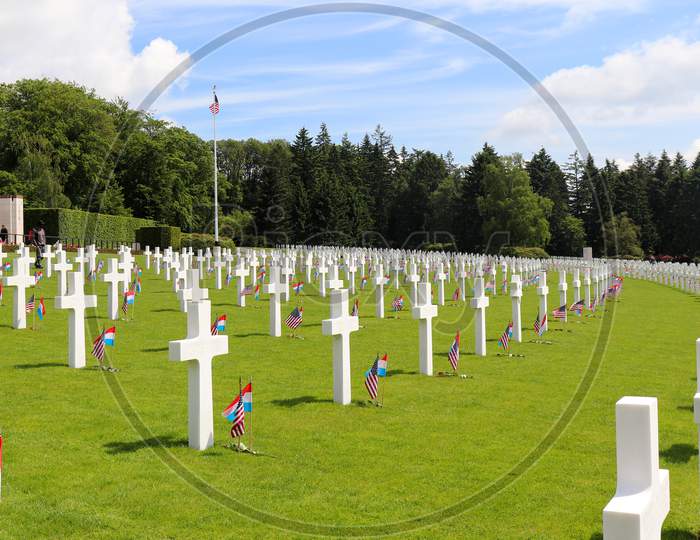 Rows Of Headstones At A Military Cemetery