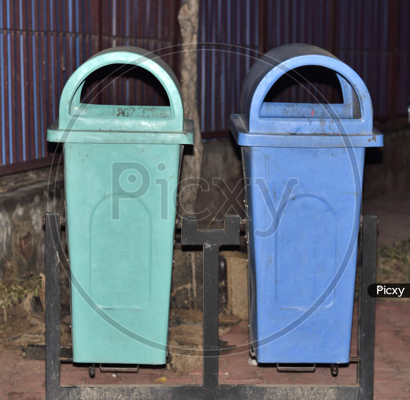 Blue And Green Dustbin Placed By Government To Keep The City Clean