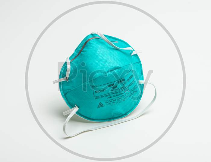 A Single Turquoise 3M N95 Respirator Face Mask