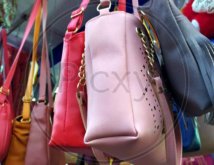 beautiful woman purse handbag hanging on a shop