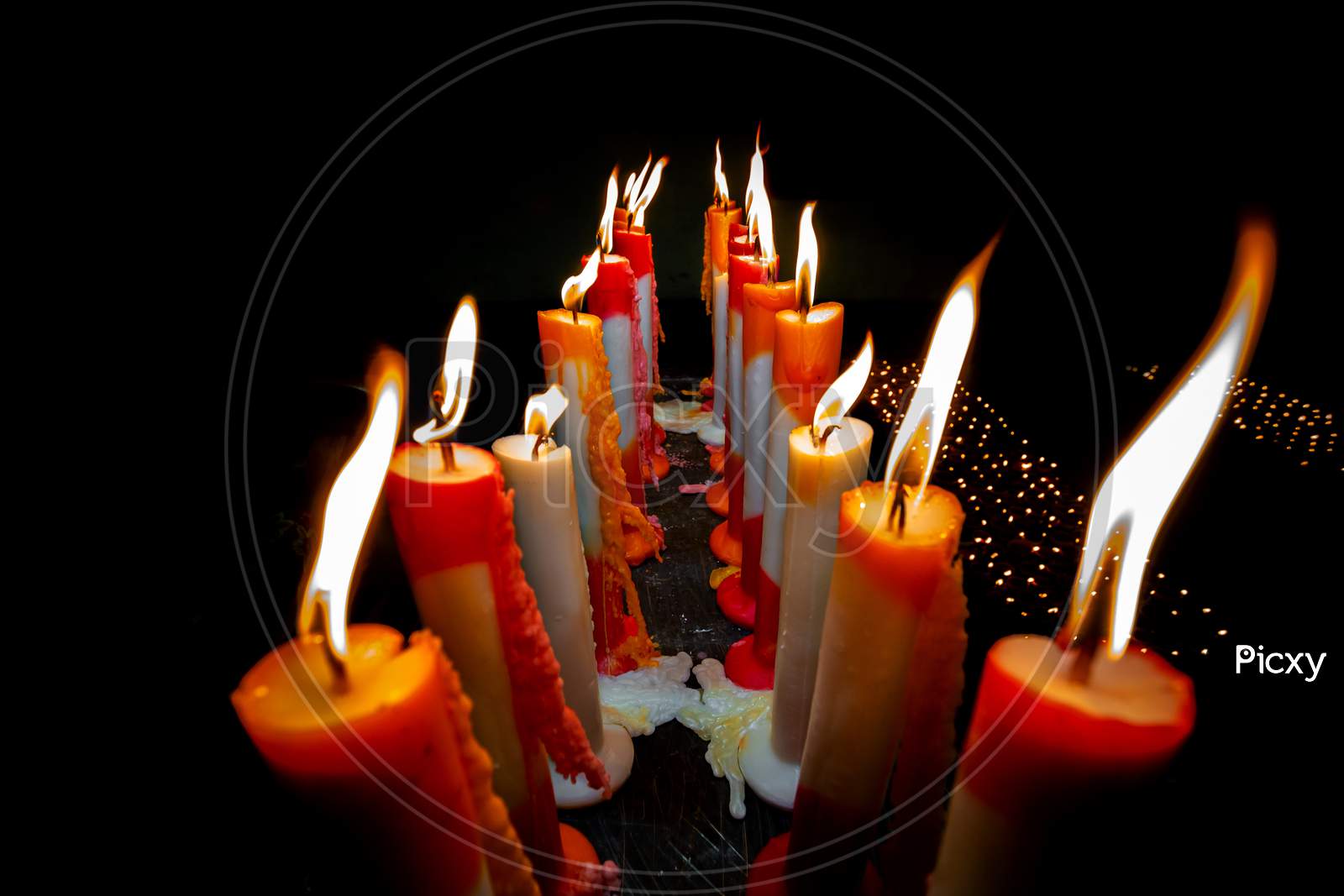 Numerous Colorful Candles Are Flaming In The Temple.