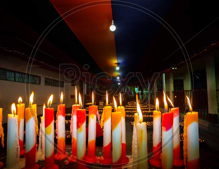 Bangladesh – October 13, 2019: Numerous Colorful Candles Are Flaming In The Buddhist Temple At Ujani Para Buddhist Temple In Bandarban, Bangladesh.