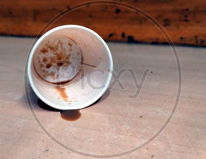 red and white paper Coffee in opened disposable cup