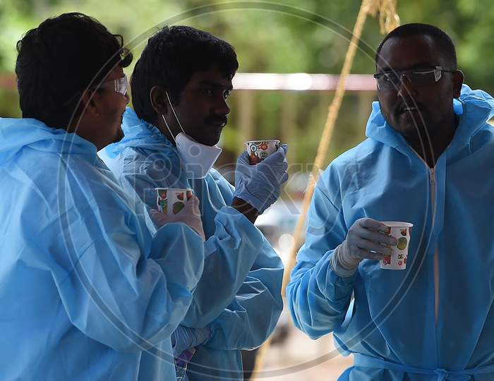 Health Workers Take A Break Before Conducting The Thermal Screening Of Migrant Labourers From Bihar During The Ongoing Nationwide Lockdown In The Wake Of Coronavirus Pandemic, In Chennai